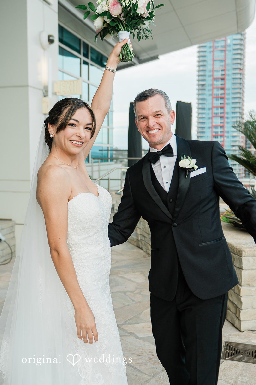 Groom playfully dipping the bride