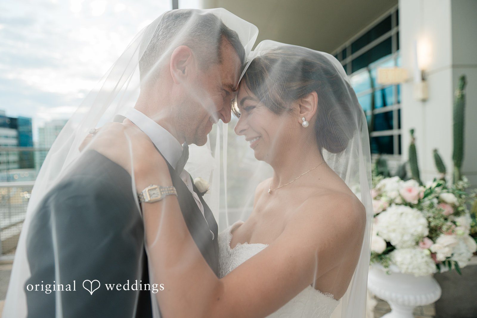 Bride and groom touching foreheads