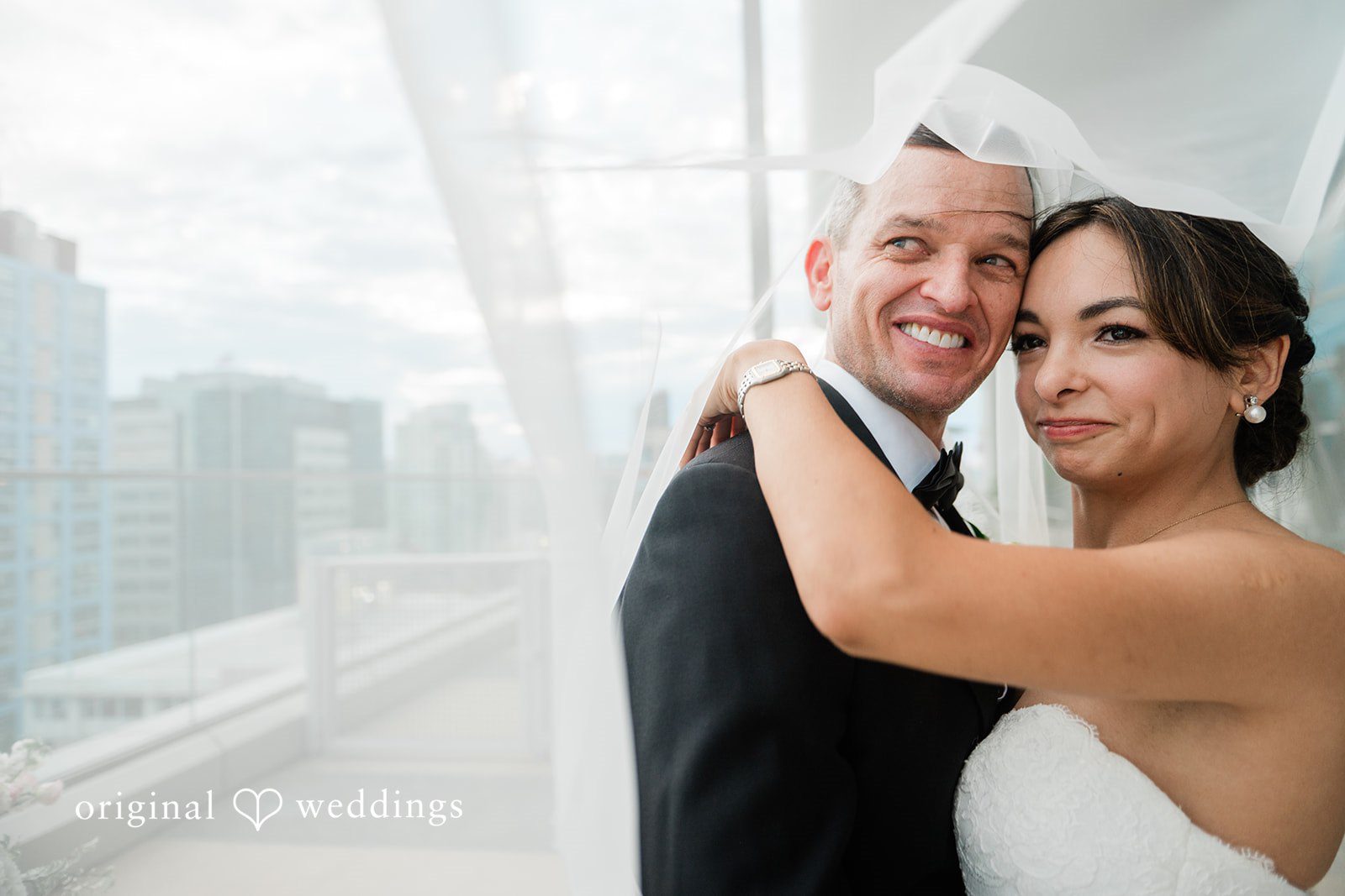 Bride and groom embracing and smiling
