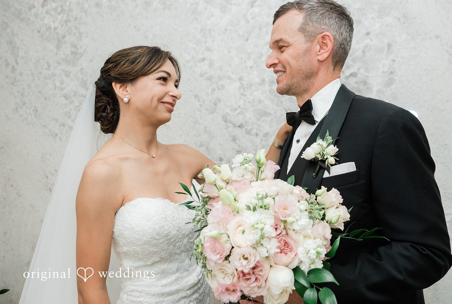 Victoire and Brett smiling together, captured by San Diego wedding photographers from Original Weddings at Fleurette