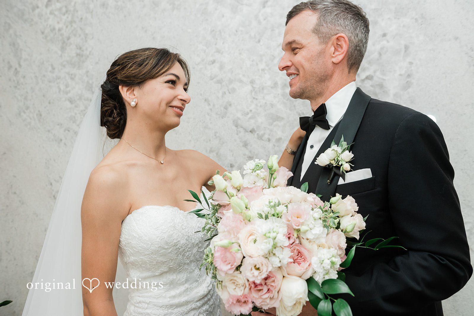 Victoire and Brett smiling together, captured by San Diego wedding photographers from Original Weddings at Fleurette