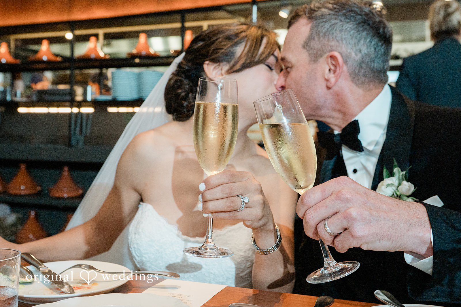 Couple toasting at the reception