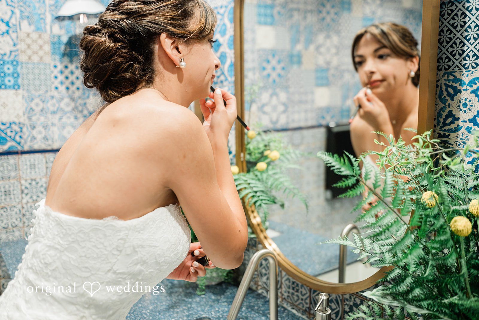 Bride checking her look in the mirror