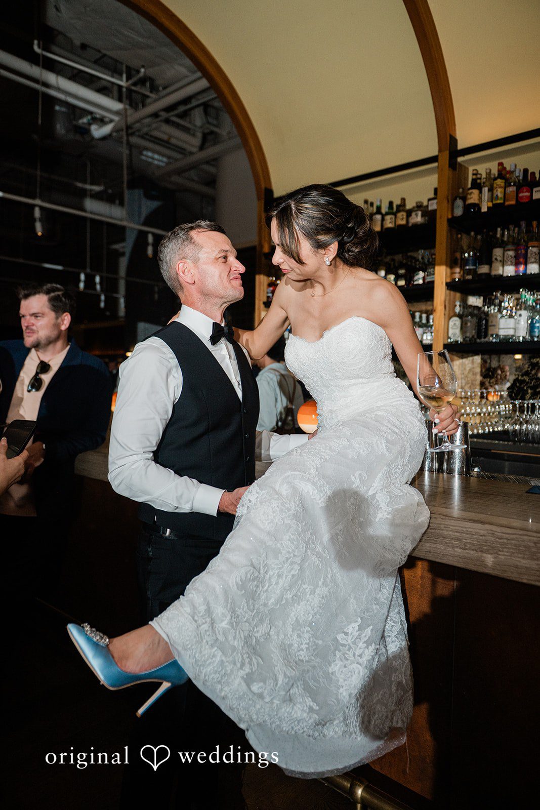 Groom lifting the bride on the dance floor