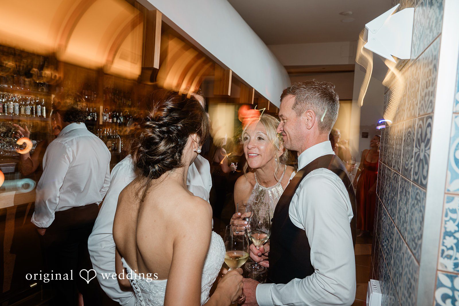Couple kissing at the reception