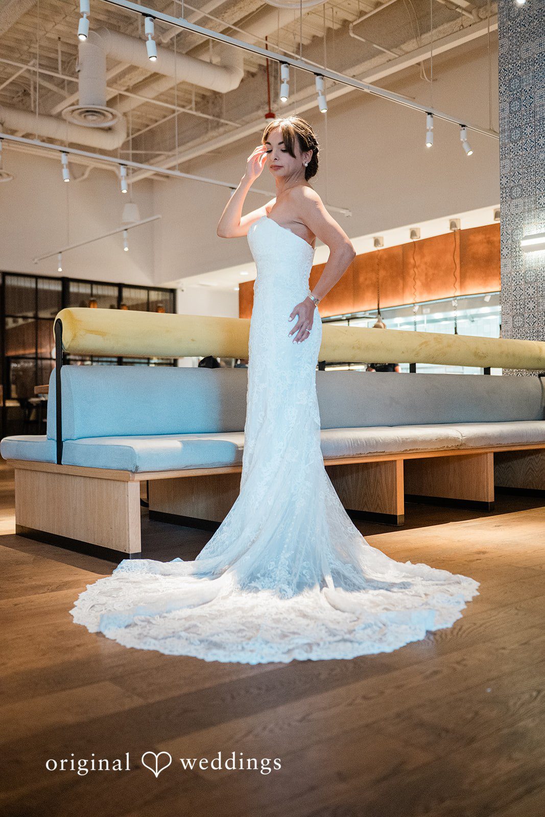 Bride showing the long train of her dress