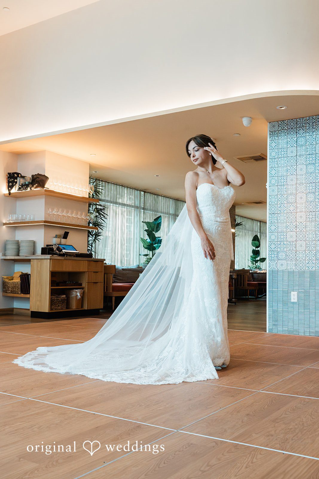 Victoire in her gown by the window at Fleurette