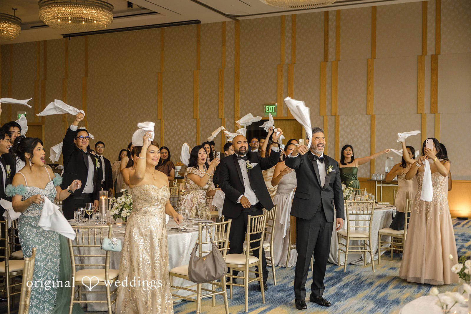 John + Michelle Guests dancing and celebrating on a lively reception dance floor.