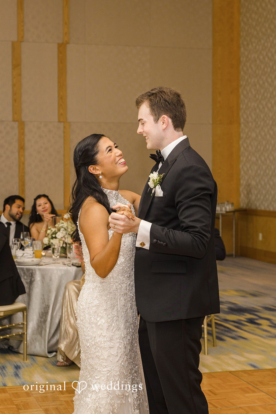 John + Michelle Bride and groom sharing their first dance together at the wedding reception.