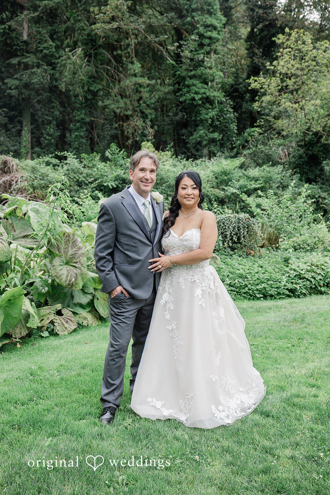 Kim + Keven A bride and groom standing together on a grassy field.