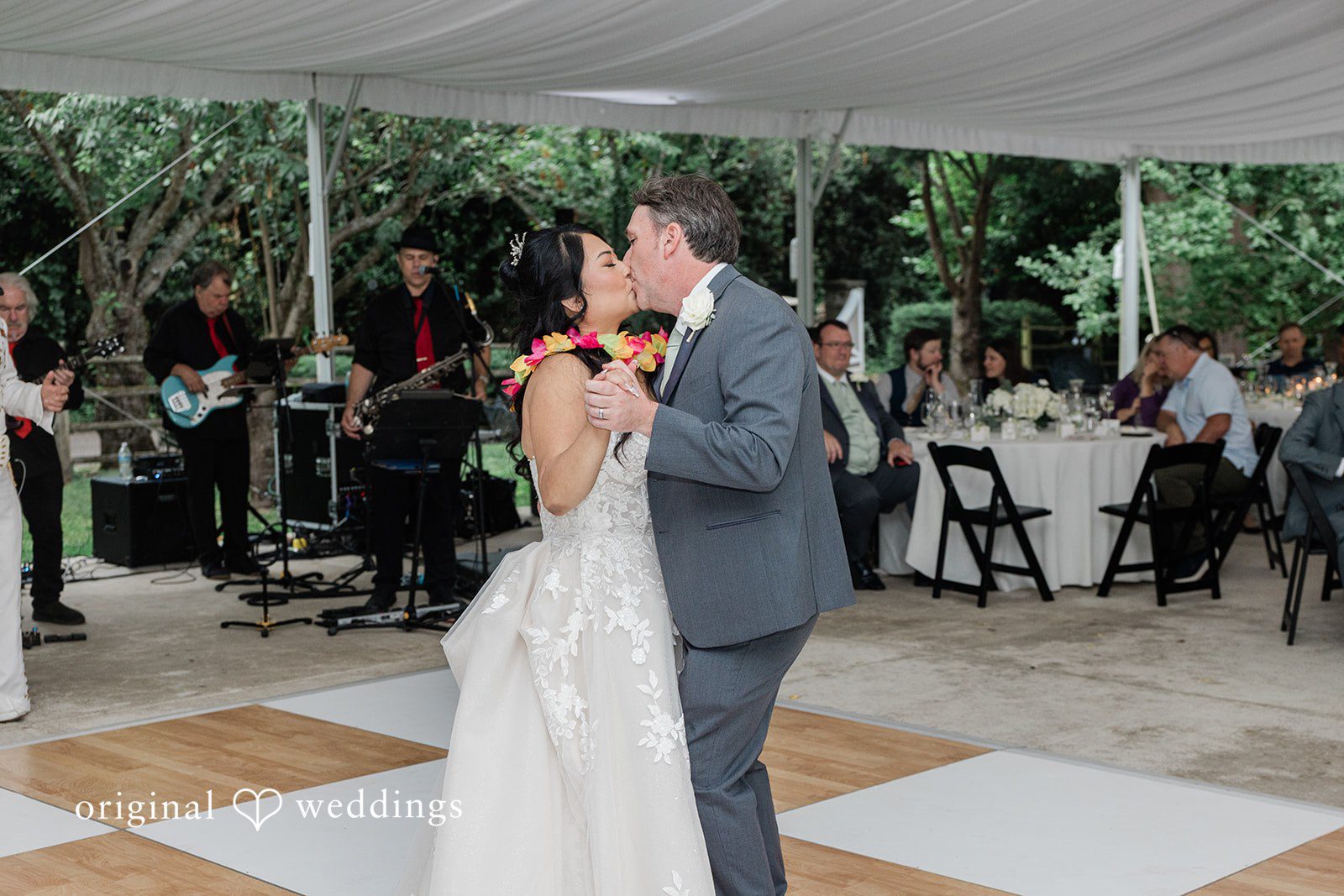 Kim + Keven A bride and groom sharing a dance together at their reception.