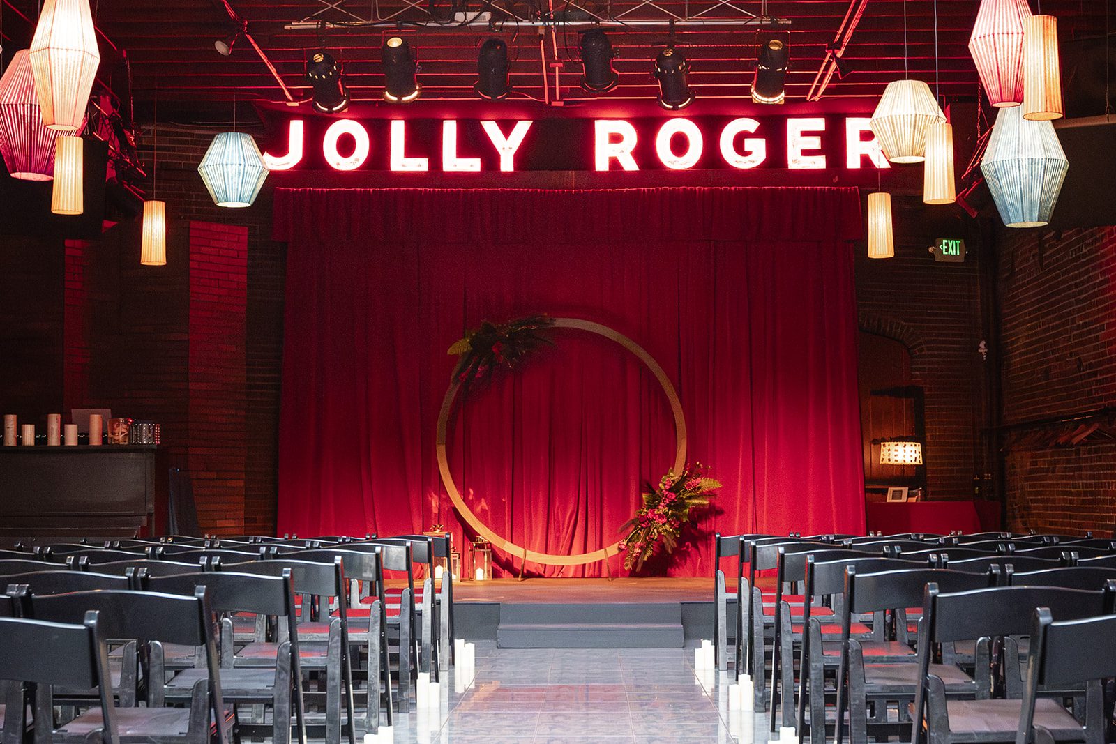 Ceremony stage under the Jolly Roger sign at Georgetown Ballroom Ceremony stage under the Jolly Roger sign at Georgetown Ballroom