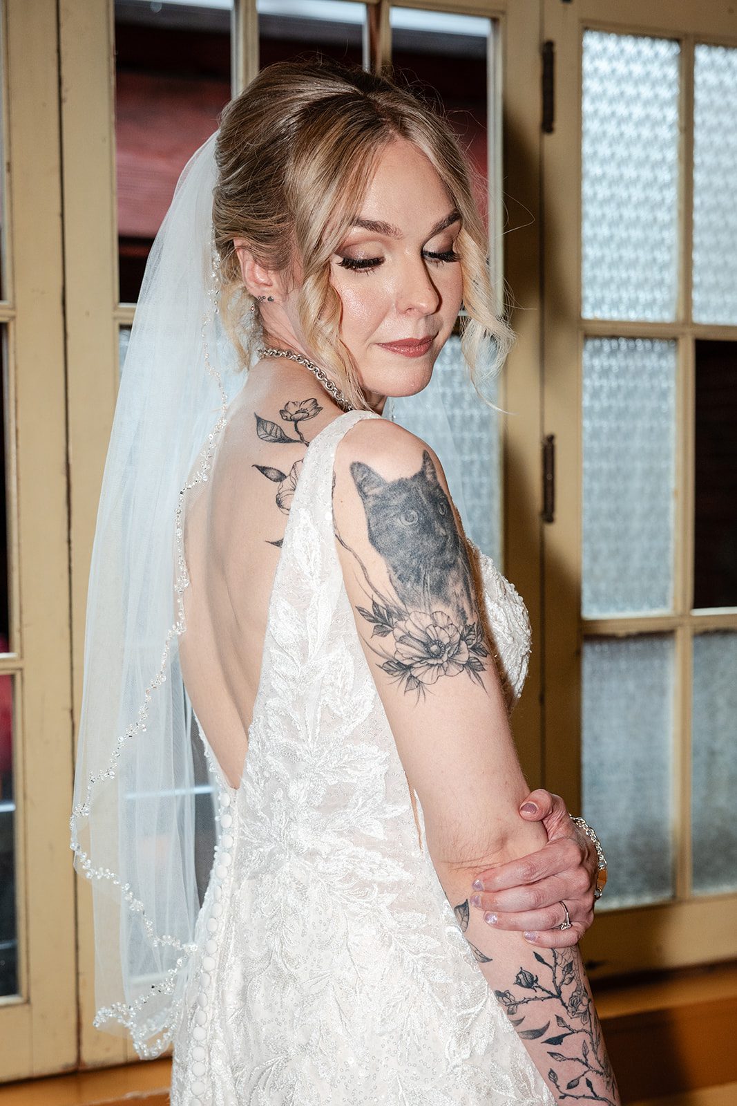 Bride with her veil over her shoulder Bride with her veil over her shoulder