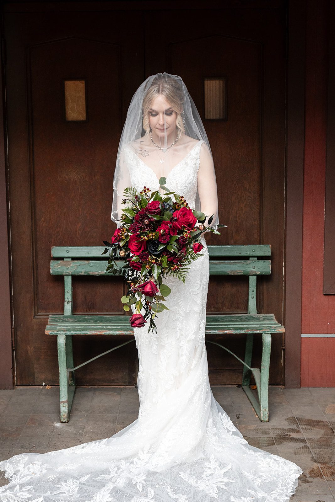 Bride seated on the garden bench with her bouquet Bride seated on the garden bench with her bouquet