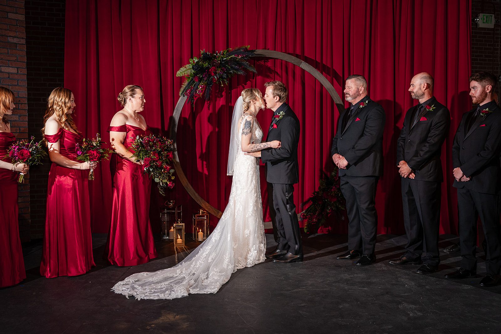 Couple sharing vows on stage Couple sharing vows on stage