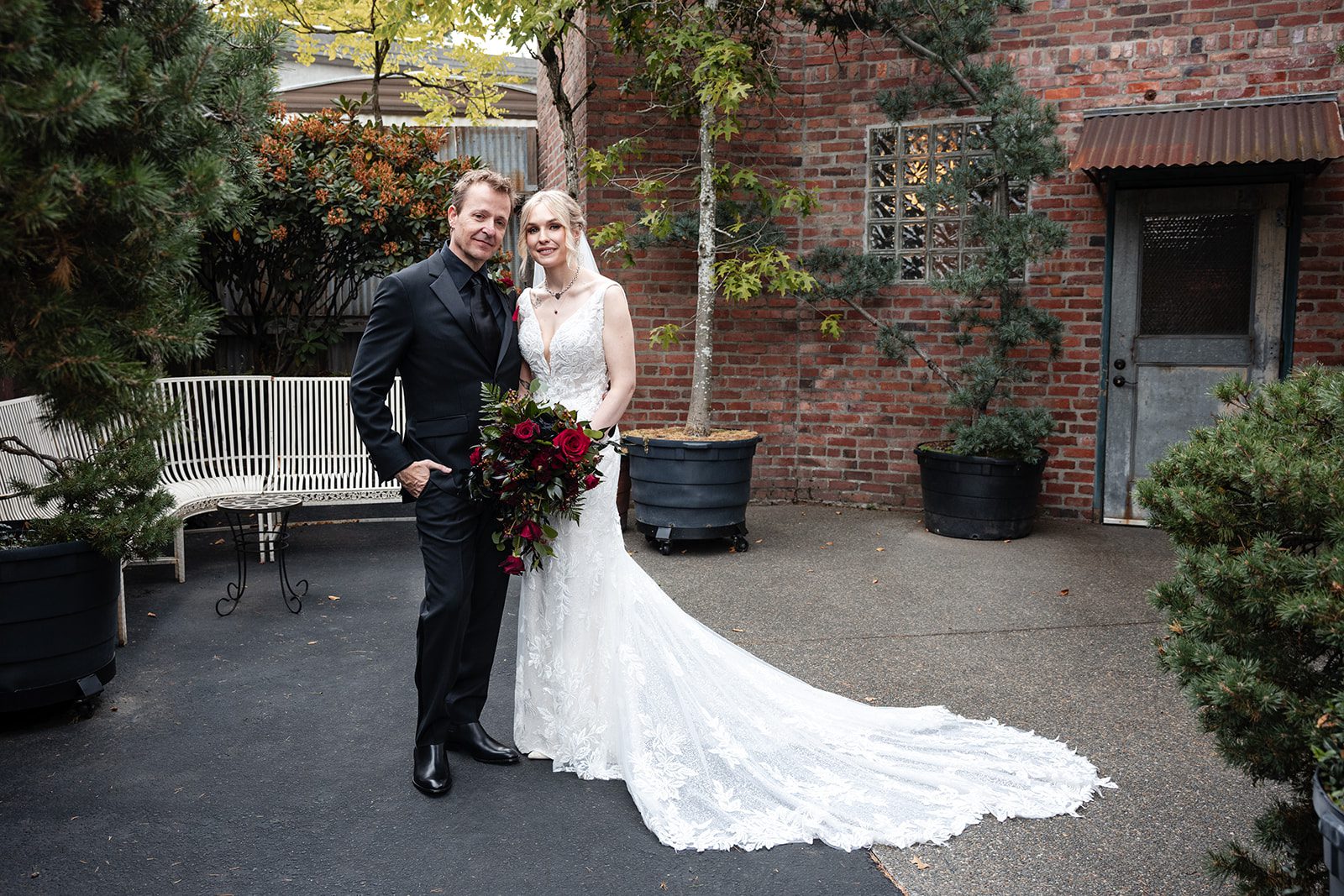 Couple standing in the courtyard at Georgetown Ballroom Couple standing in the courtyard at Georgetown Ballroom