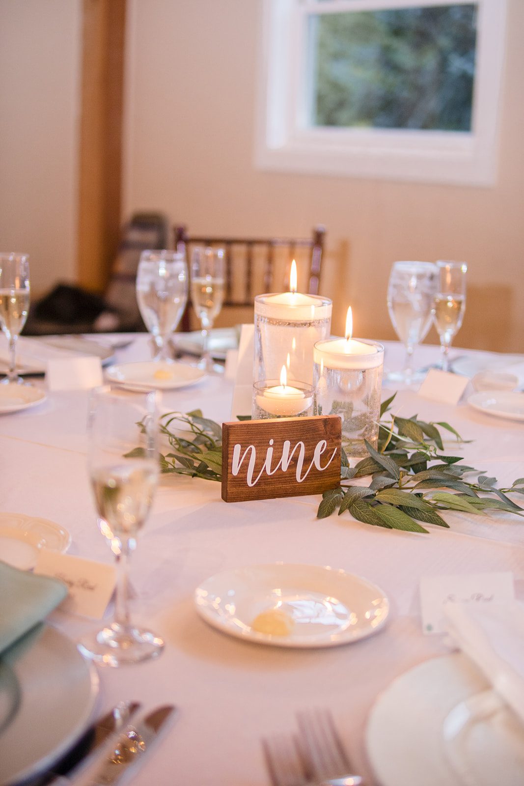 Table setting with greenery and candles at Glasbern