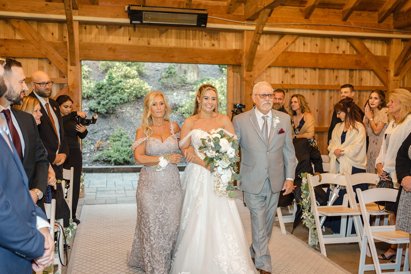 Bride walking down the aisle with a loved one