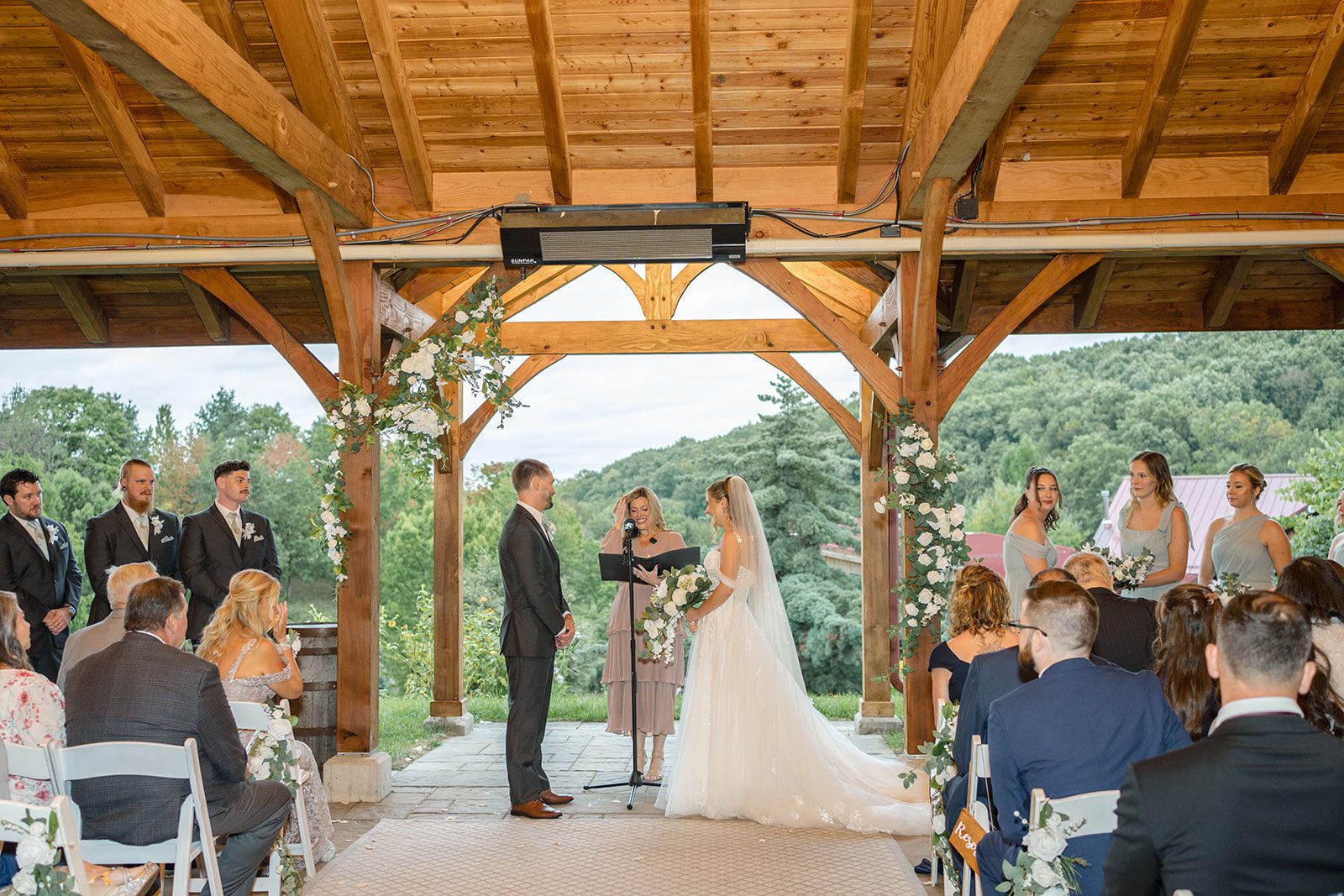 Guests watching the ceremony under the pavilion