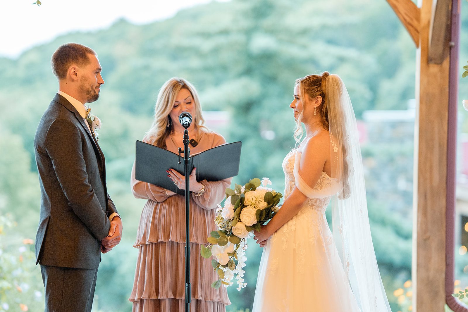 Couple exchanging vows with valley views at Glasbern