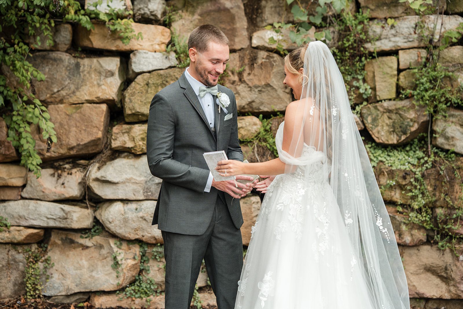 Couple sharing a smile at the first look