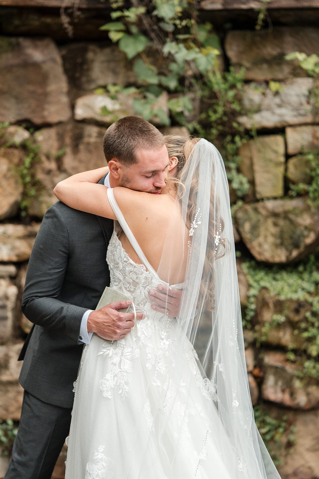 Bride and groom hugging after the first look