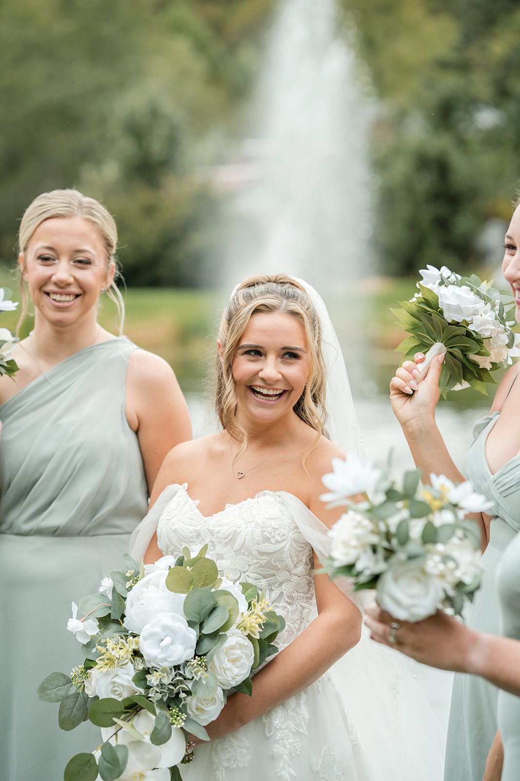 Bride laughing with her bridesmaids