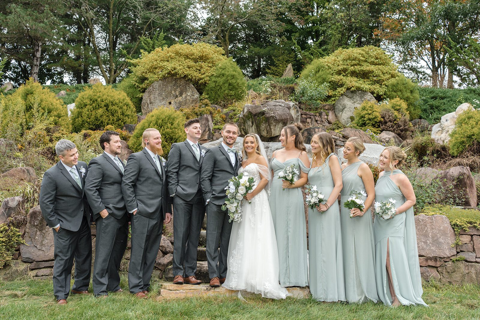 Full wedding party in the rock garden at Glasbern