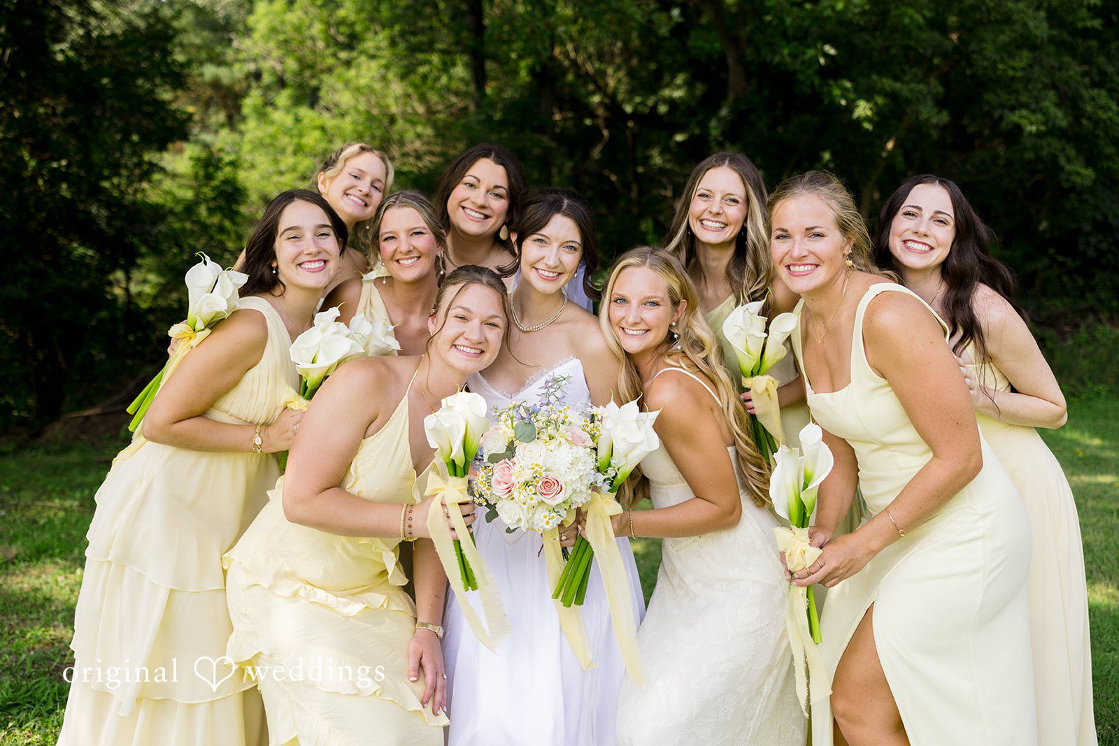 Ethan + Kelcy Bride smiling with her bridesmaids in yellow dresses