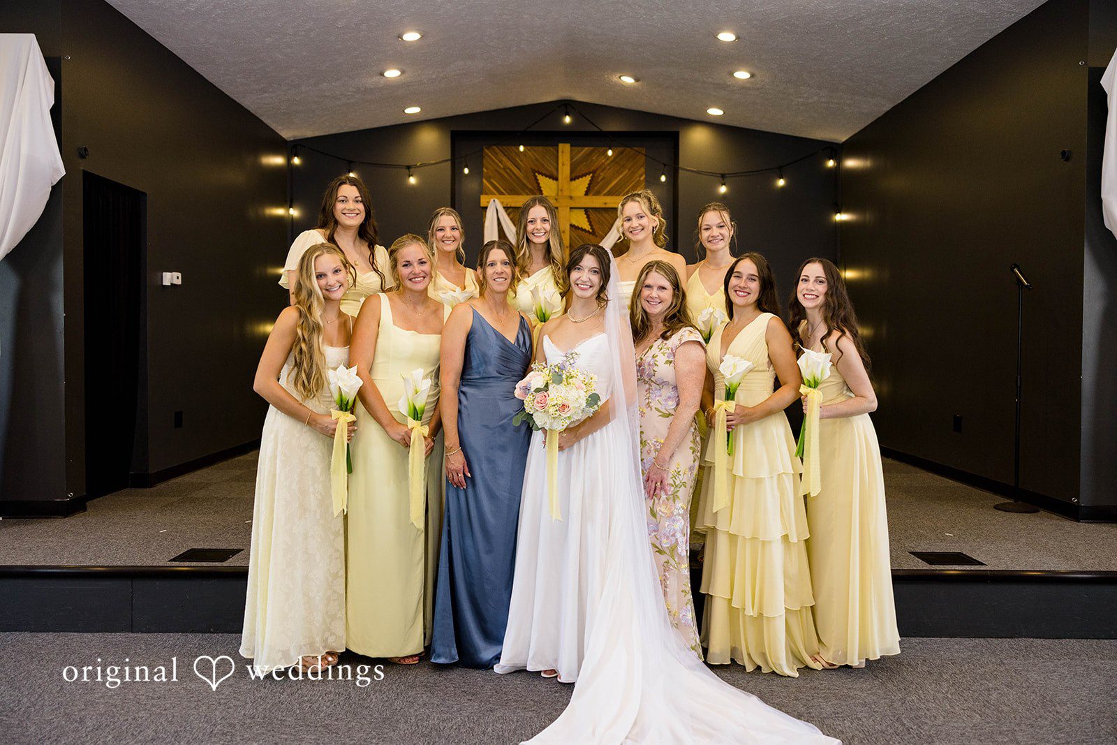 Ethan + Kelcy Bride and bridesmaids standing at the altar at Grace Church Barberton