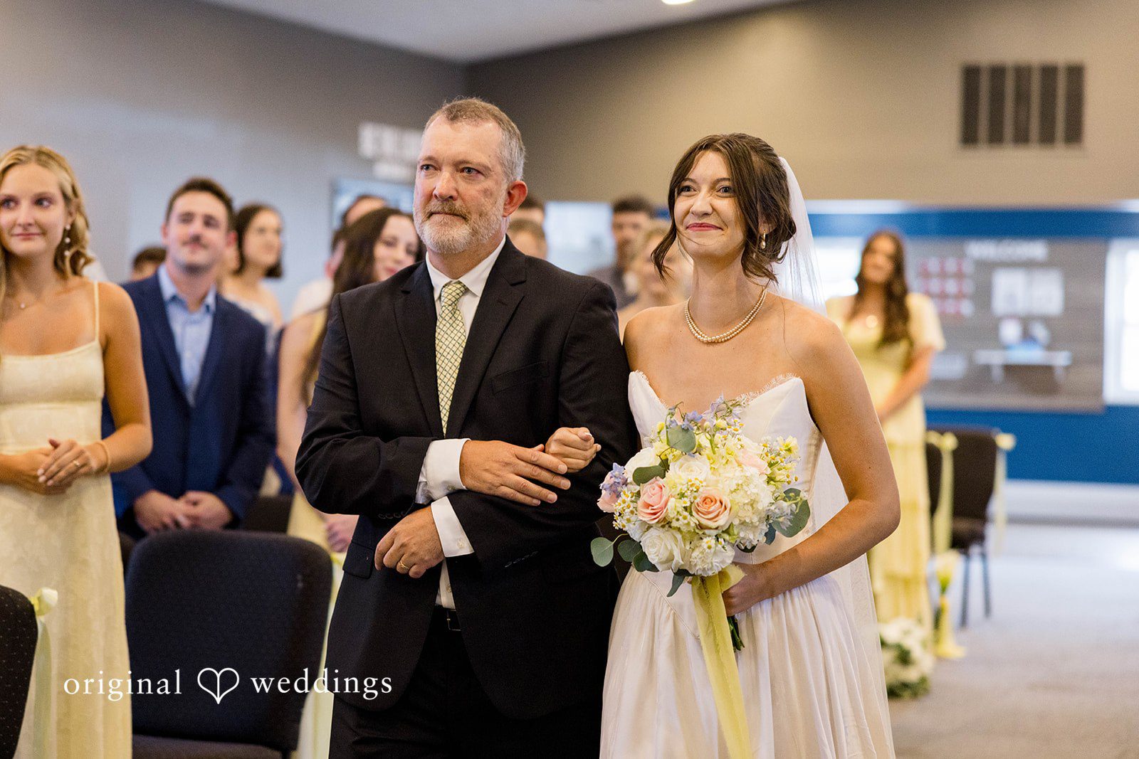 Ethan + Kelcy Bride walking down the aisle with her father at Grace Church Barberton
