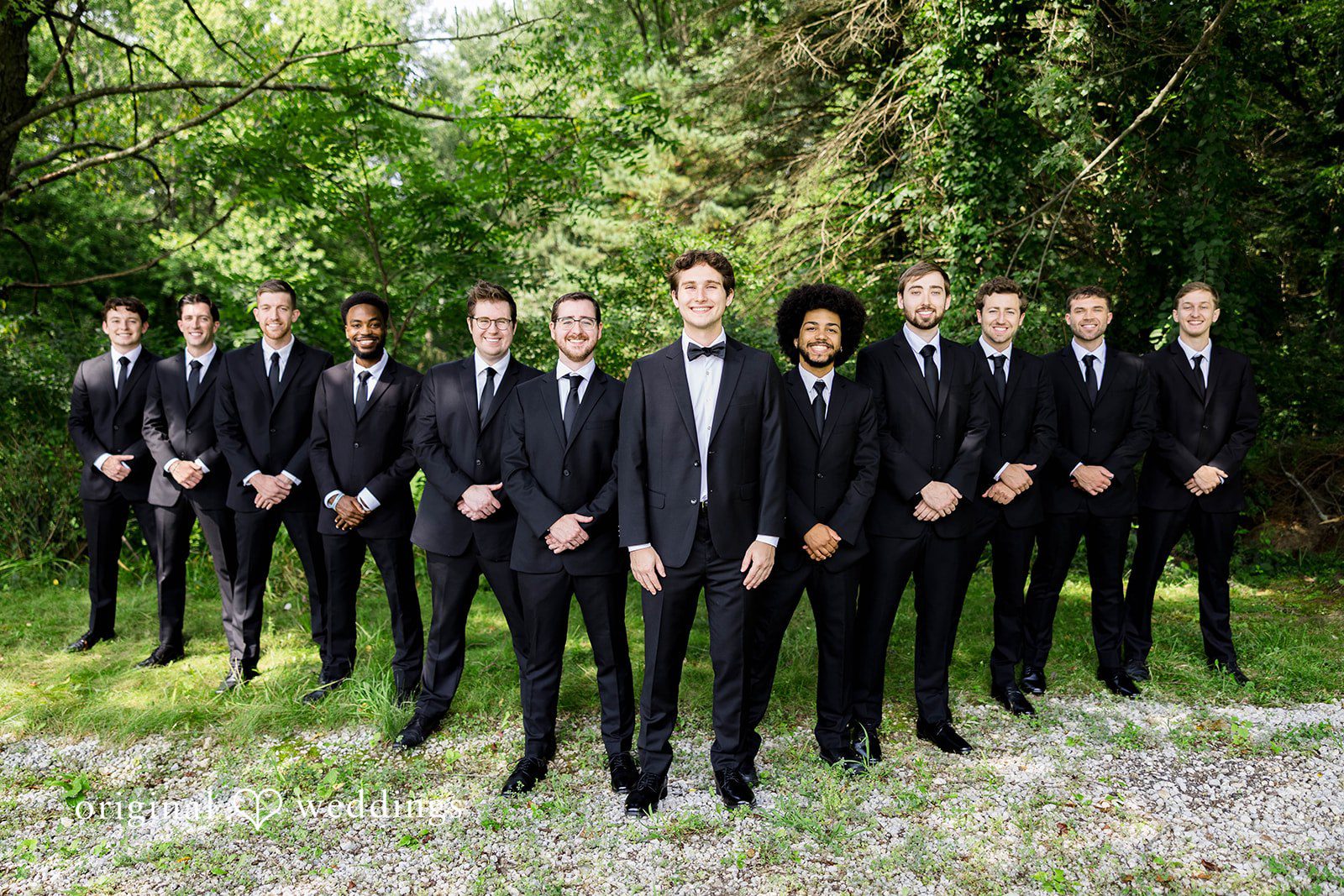 Ethan + Kelcy Groom standing with his groomsmen
