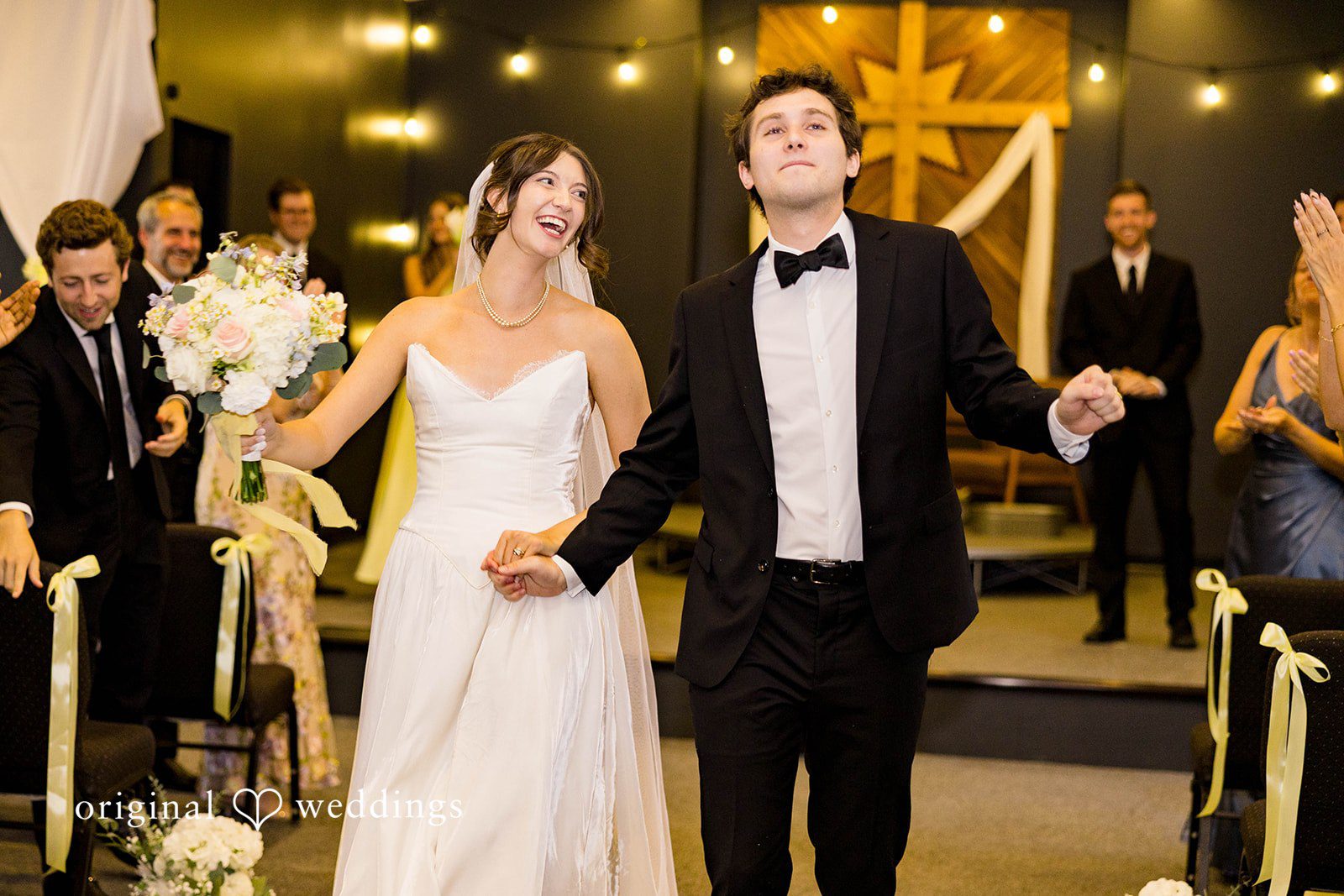 Ethan + Kelcy Couple laughing at the altar