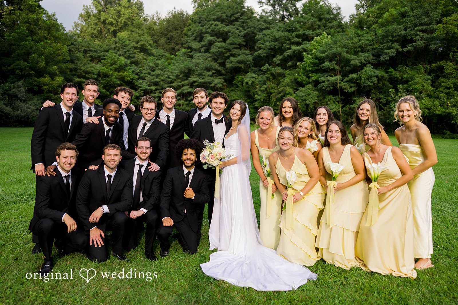 Ethan + Kelcy Wedding party posing together outdoors