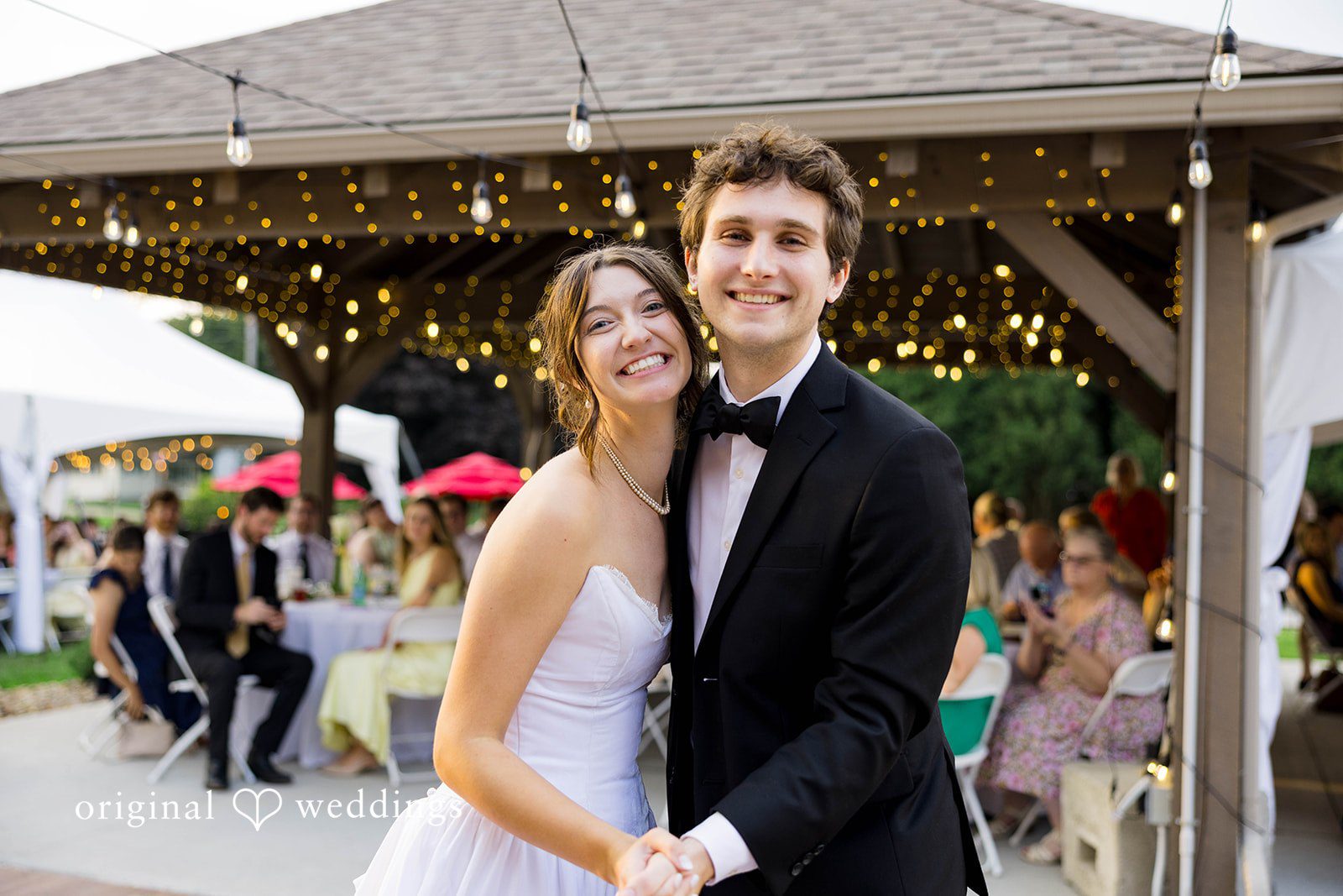 Ethan + Kelcy Couple smiling under the reception tent