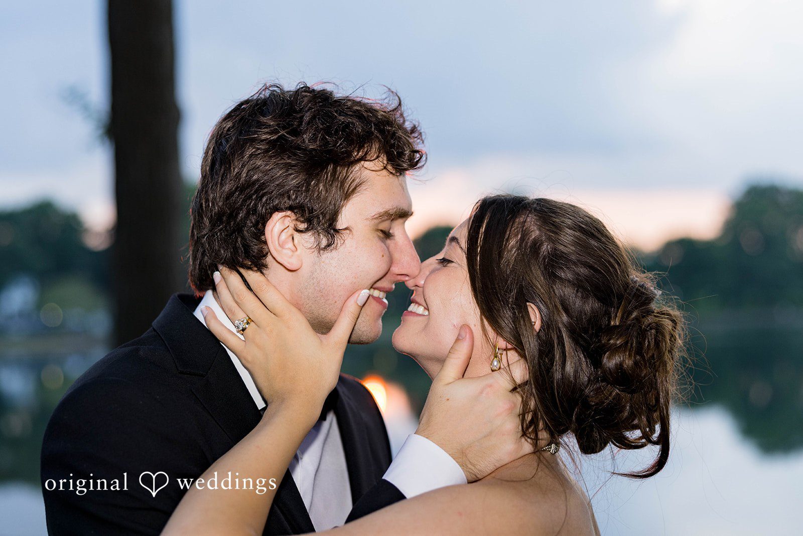 Ethan + Kelcy Couple touching foreheads by the lake