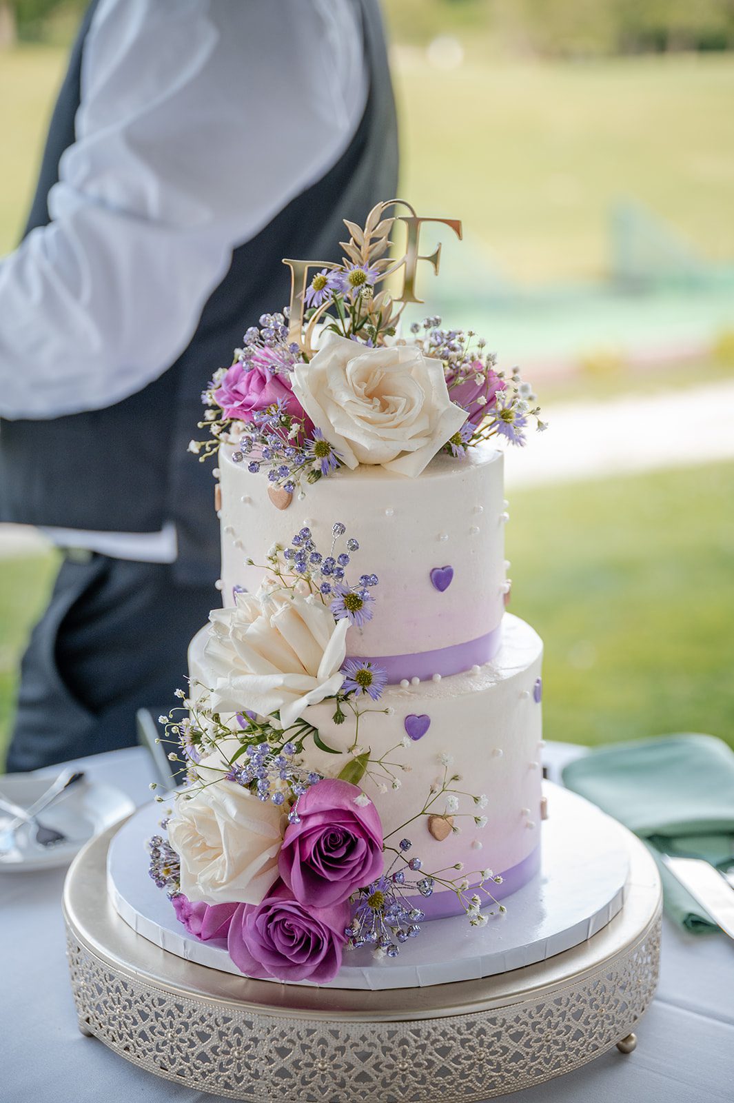 harbor-lights-timeless-providence-feng-donald-p003-53 Tiered wedding cake with pink and purple flowers