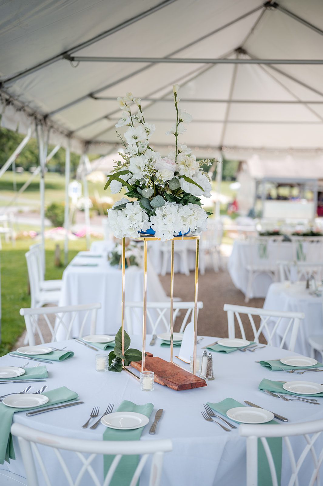 harbor-lights-timeless-providence-feng-donald-p004-54 Reception tent tables set with florals at Harbor Lights