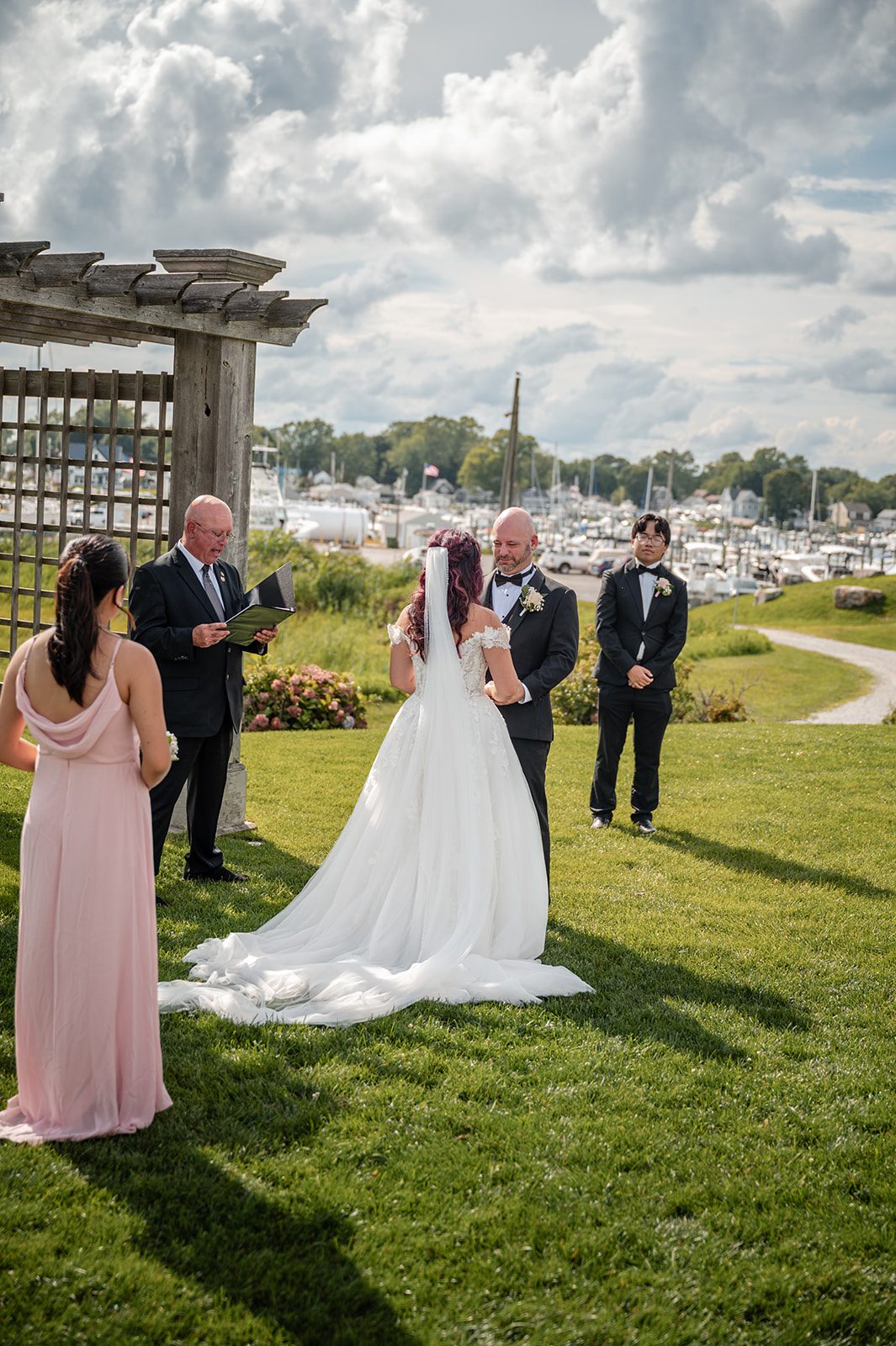harbor-lights-timeless-providence-feng-donald-p017-25 Bride walking down the aisle on the lawn