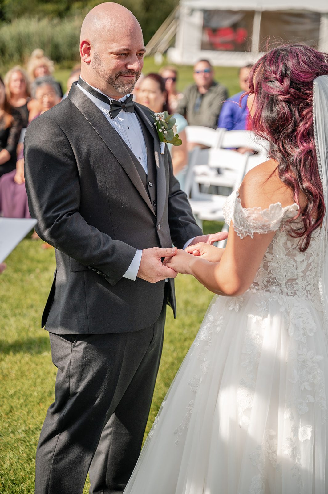 harbor-lights-timeless-providence-feng-donald-p021-31 Couple holding hands during their vows