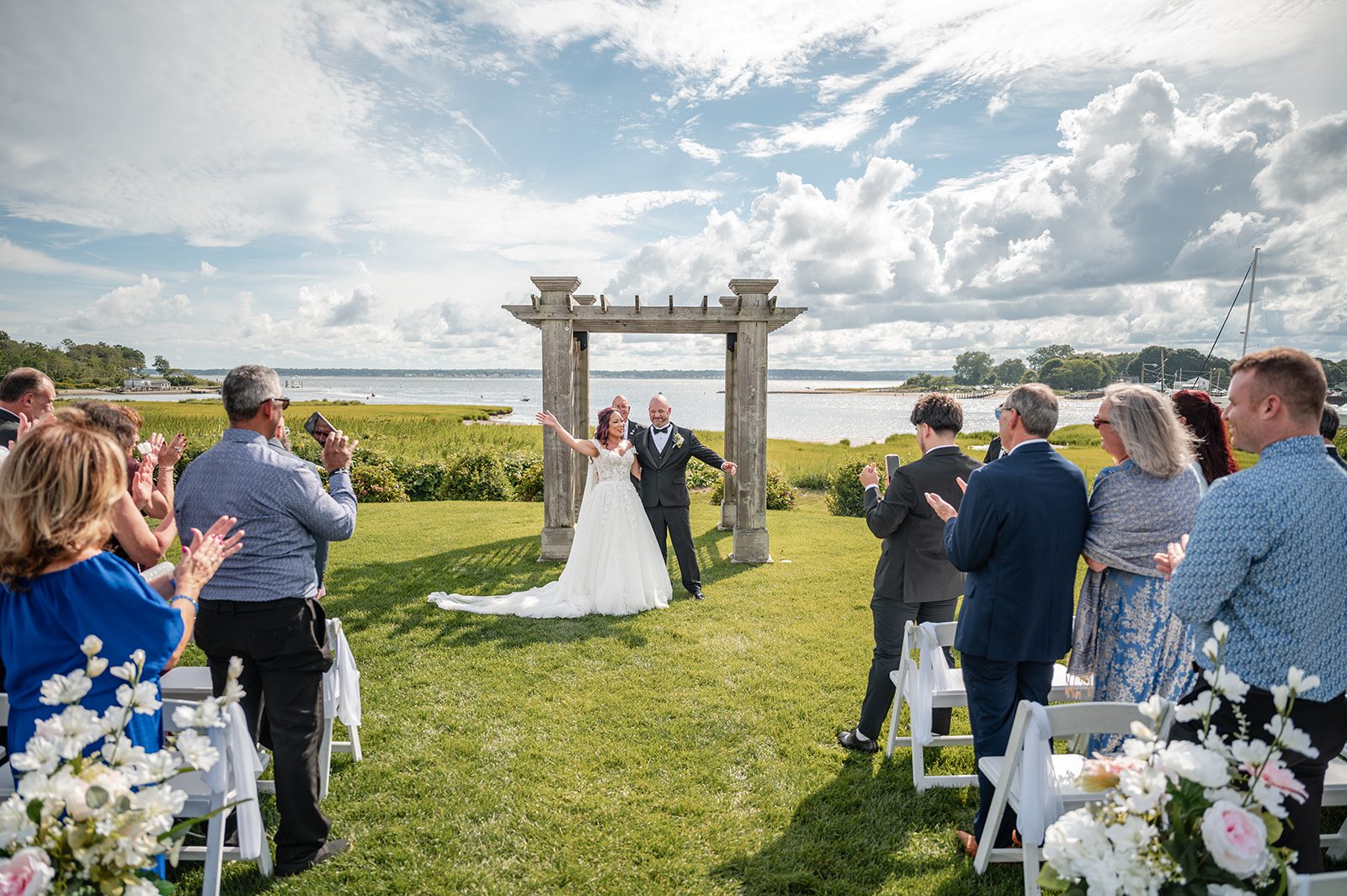 harbor-lights-timeless-providence-feng-donald-p027-44 Guests celebrating as the couple says I do