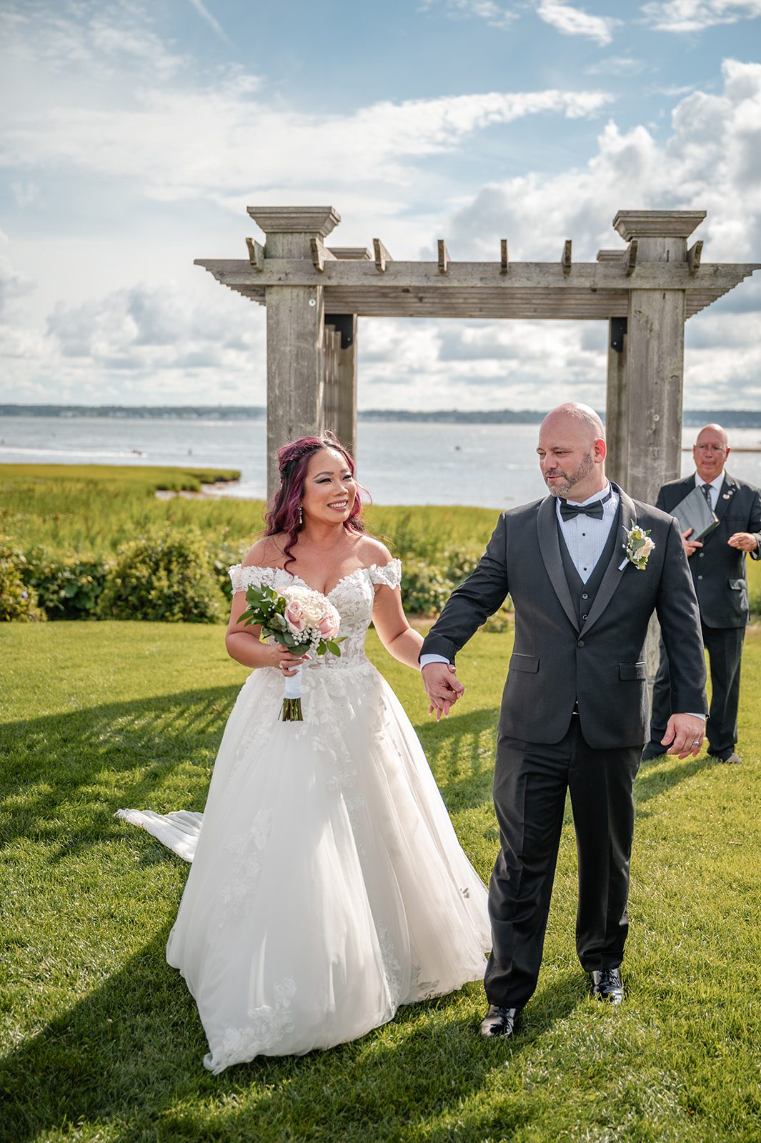 harbor-lights-timeless-providence-feng-donald-p028-28 Newlyweds celebrating after the ceremony