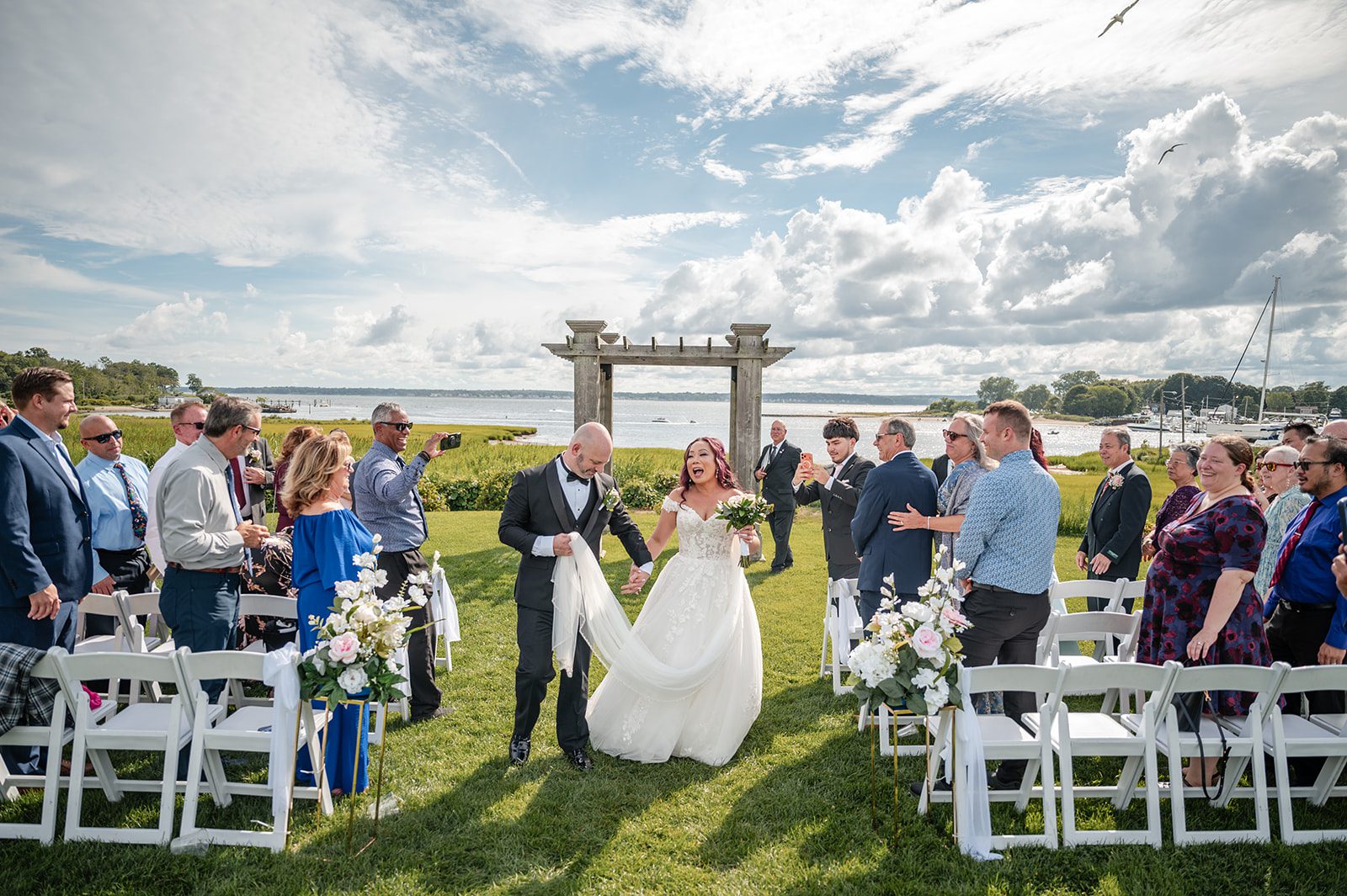 harbor-lights-timeless-providence-feng-donald-p031-51 Guests cheering for the newlyweds