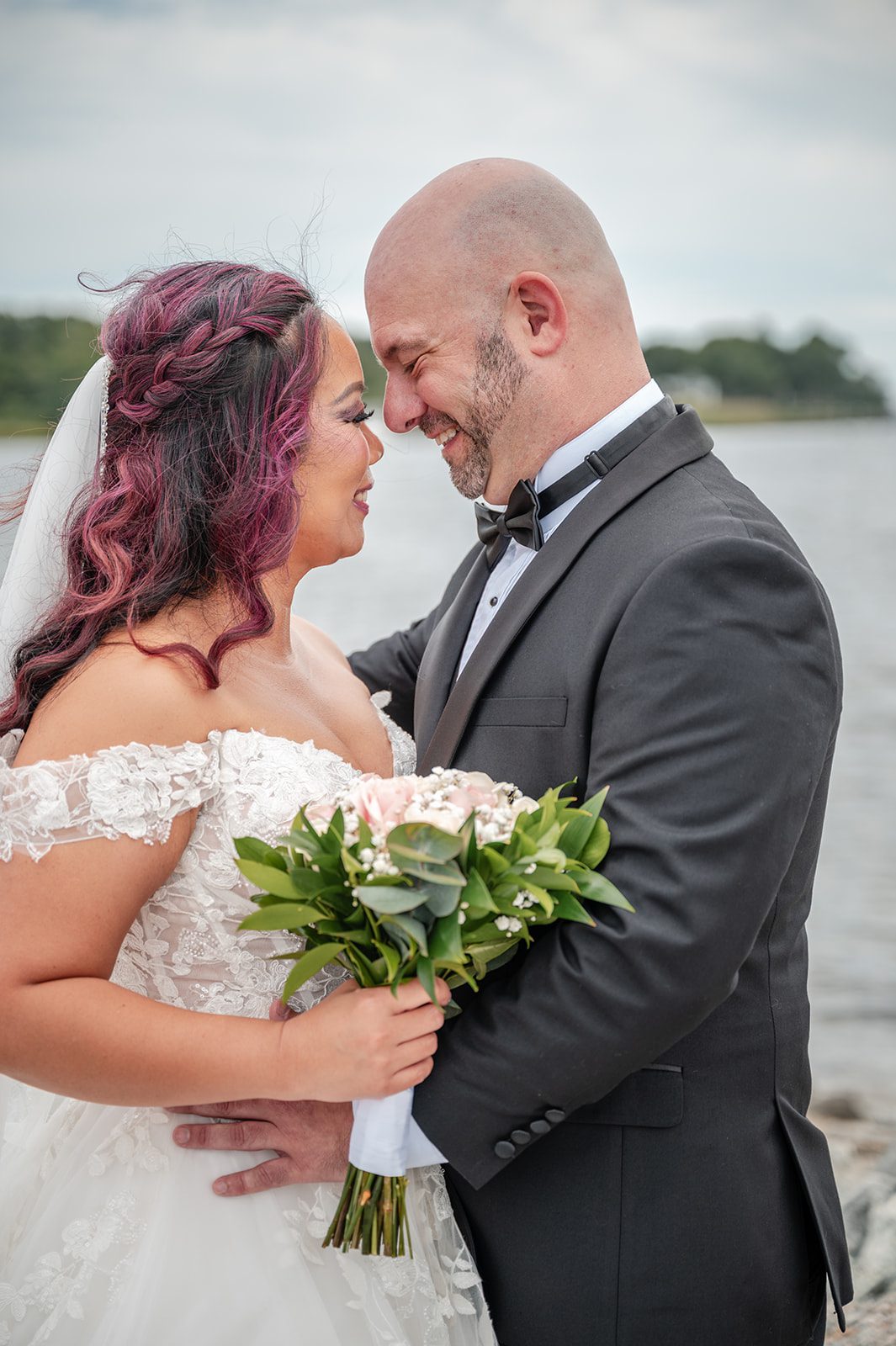 harbor-lights-timeless-providence-feng-donald-p036-52 Groom holding the bride close by the bay