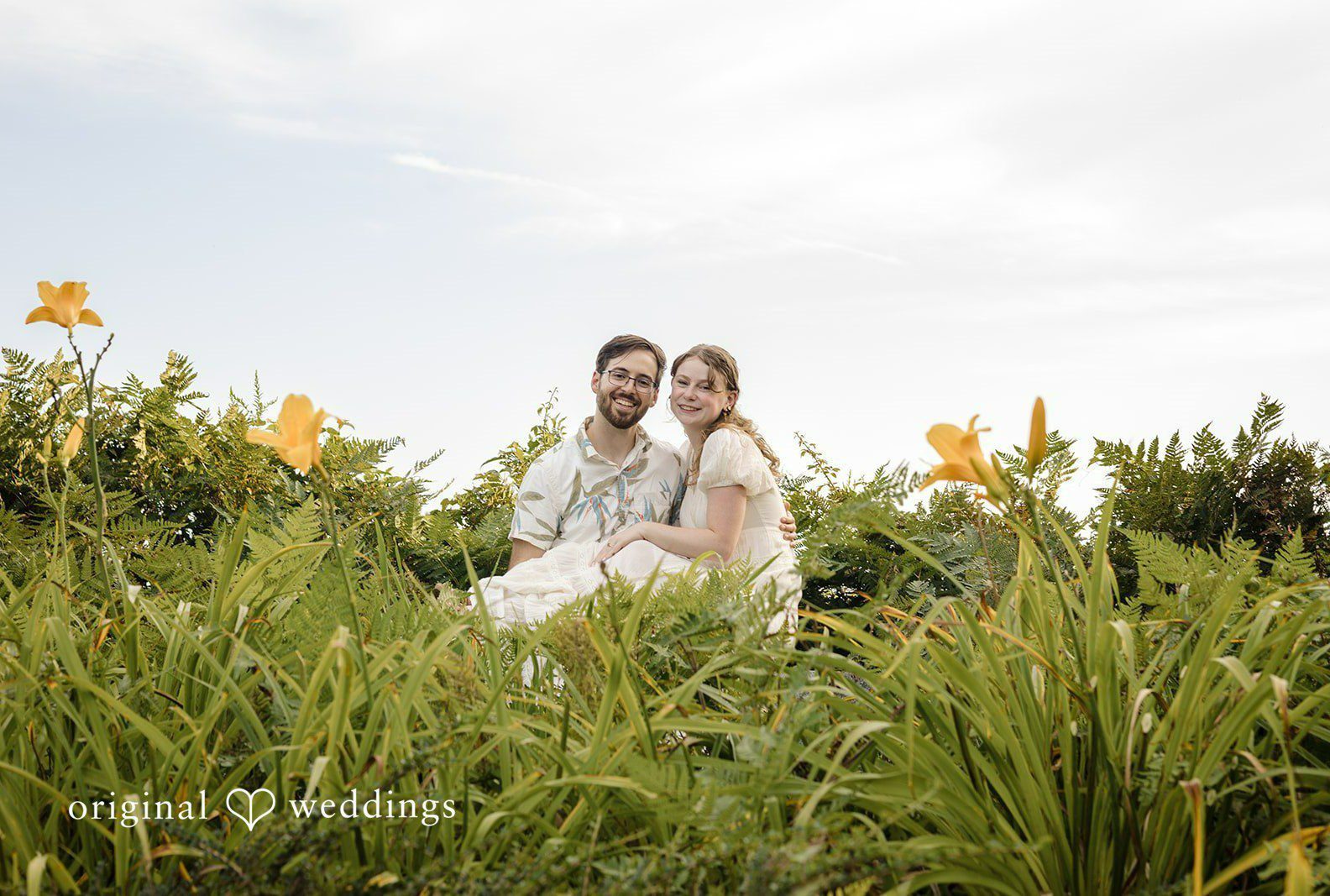 Engagement Photography Services by Original Weddings capturing close-up of couple with bride smiling at Engagement Photography Services.