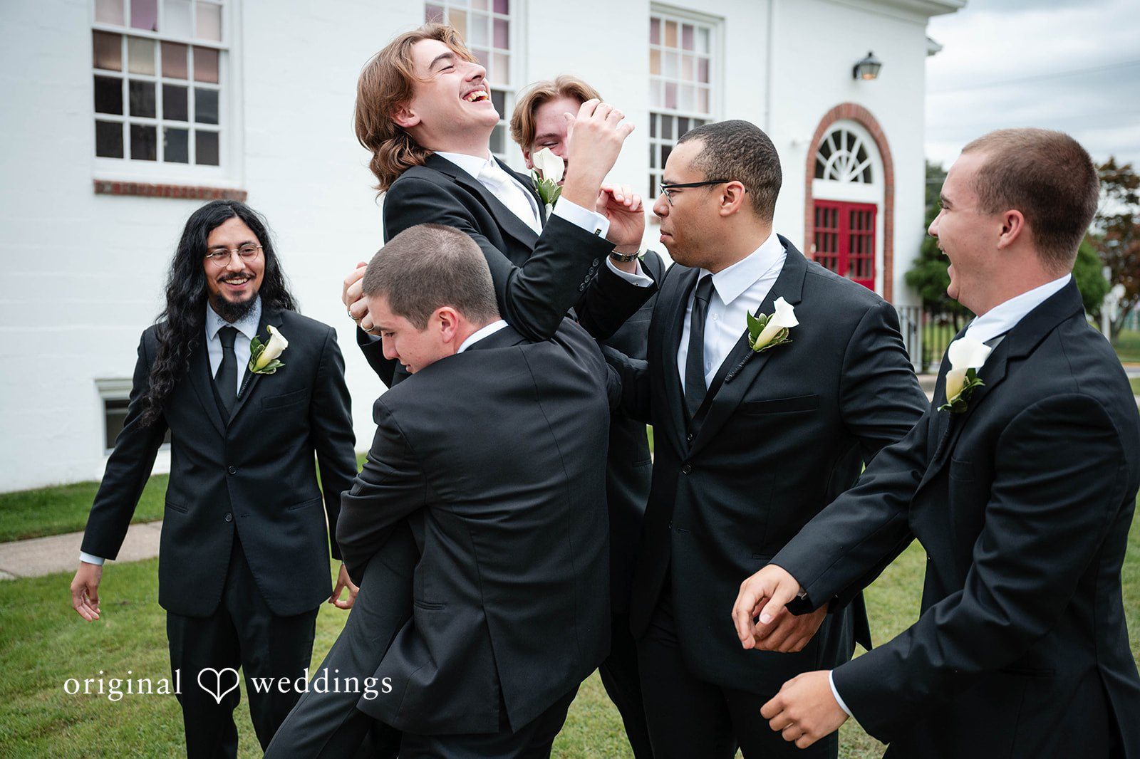Bethany + Eddie Groomsmen having fun outside at Immanuel Orthodox Presbyterian Church