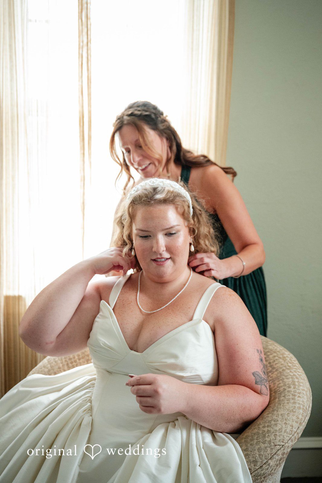 Bethany + Eddie Bride getting ready by the window