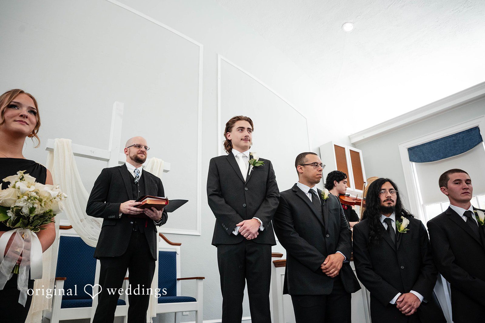 Bethany + Eddie Groom with his groomsmen inside the church
