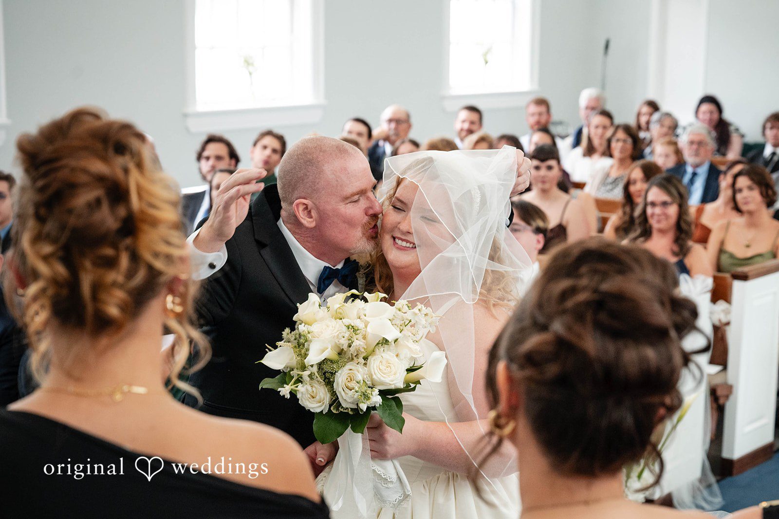 Bethany + Eddie Bride hugging loved ones