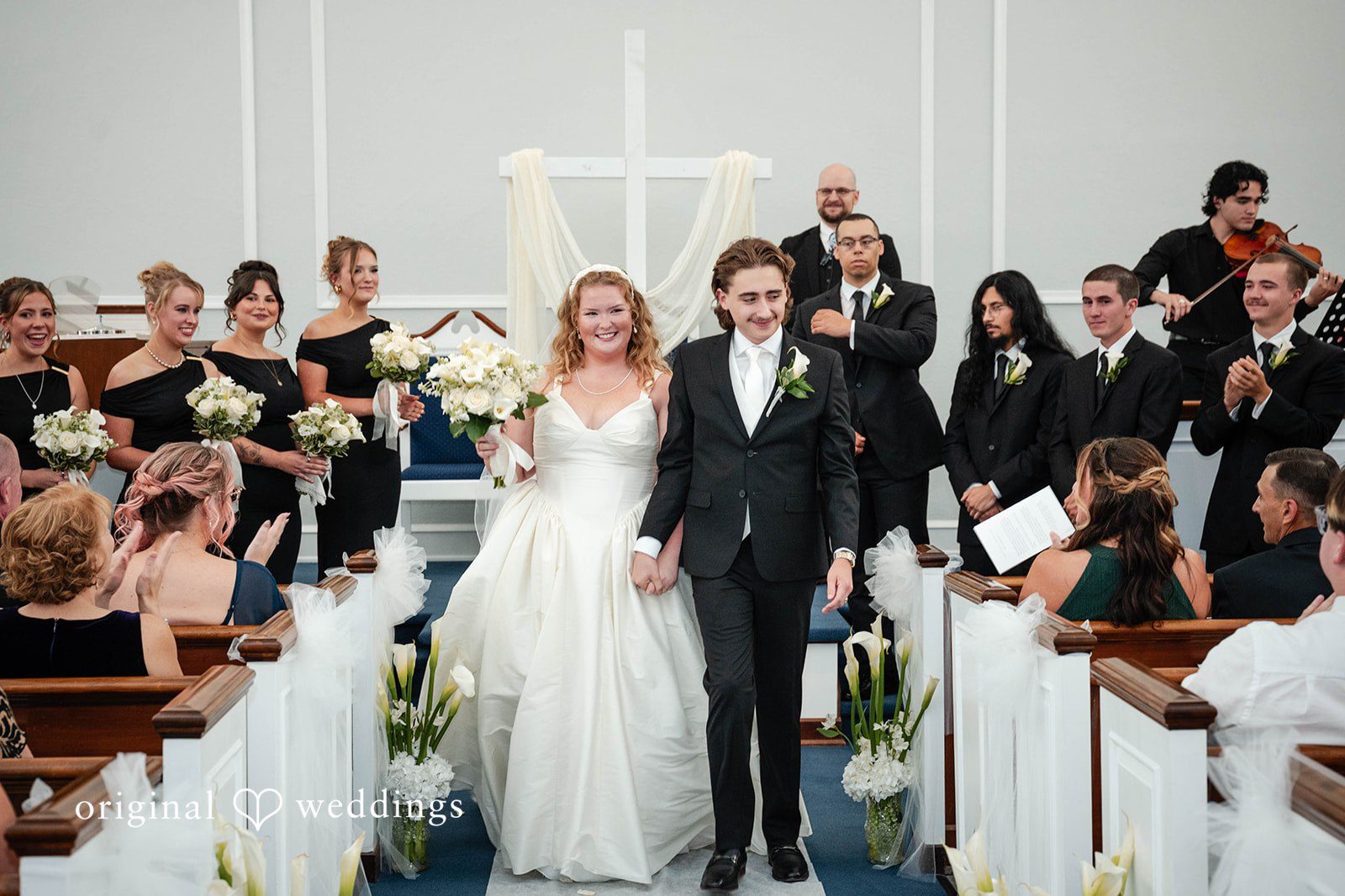 Bethany + Eddie Couple walking back up the aisle
